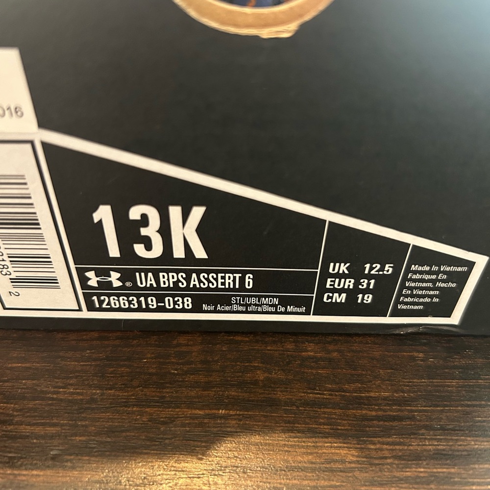 Under Armour UA BPS Assert 6 in Orange and Blue